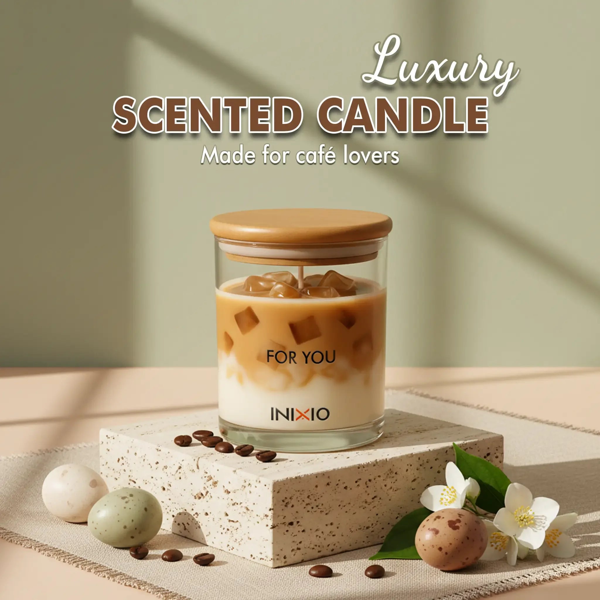 Luxury coffee-inspired scented candle in glass jar with coffee beans, flowers, and decorative eggs