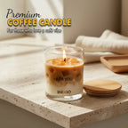 Premium coffee-scented soy wax candle in glass, lit on a stone tabletop with wooden lid nearby.