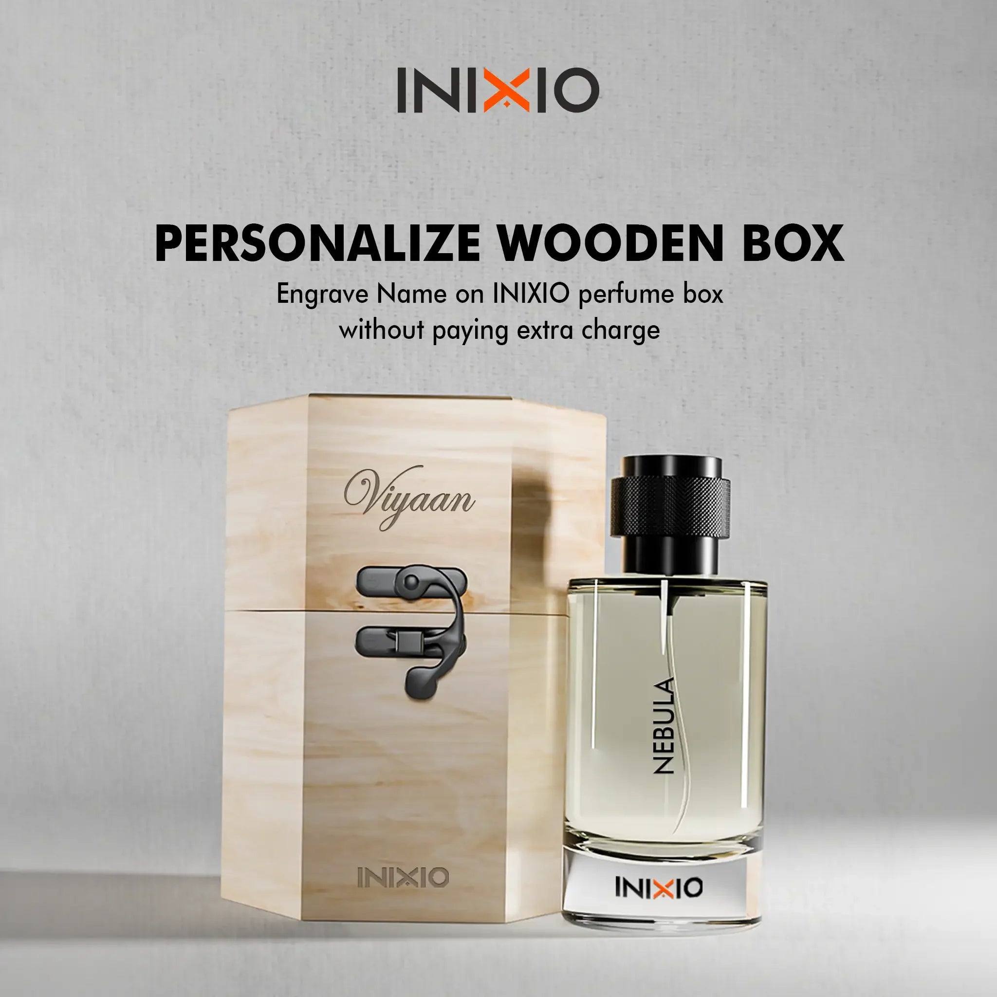 Personalized wooden perfume box with engraved name beside Nebula fragrance bottle