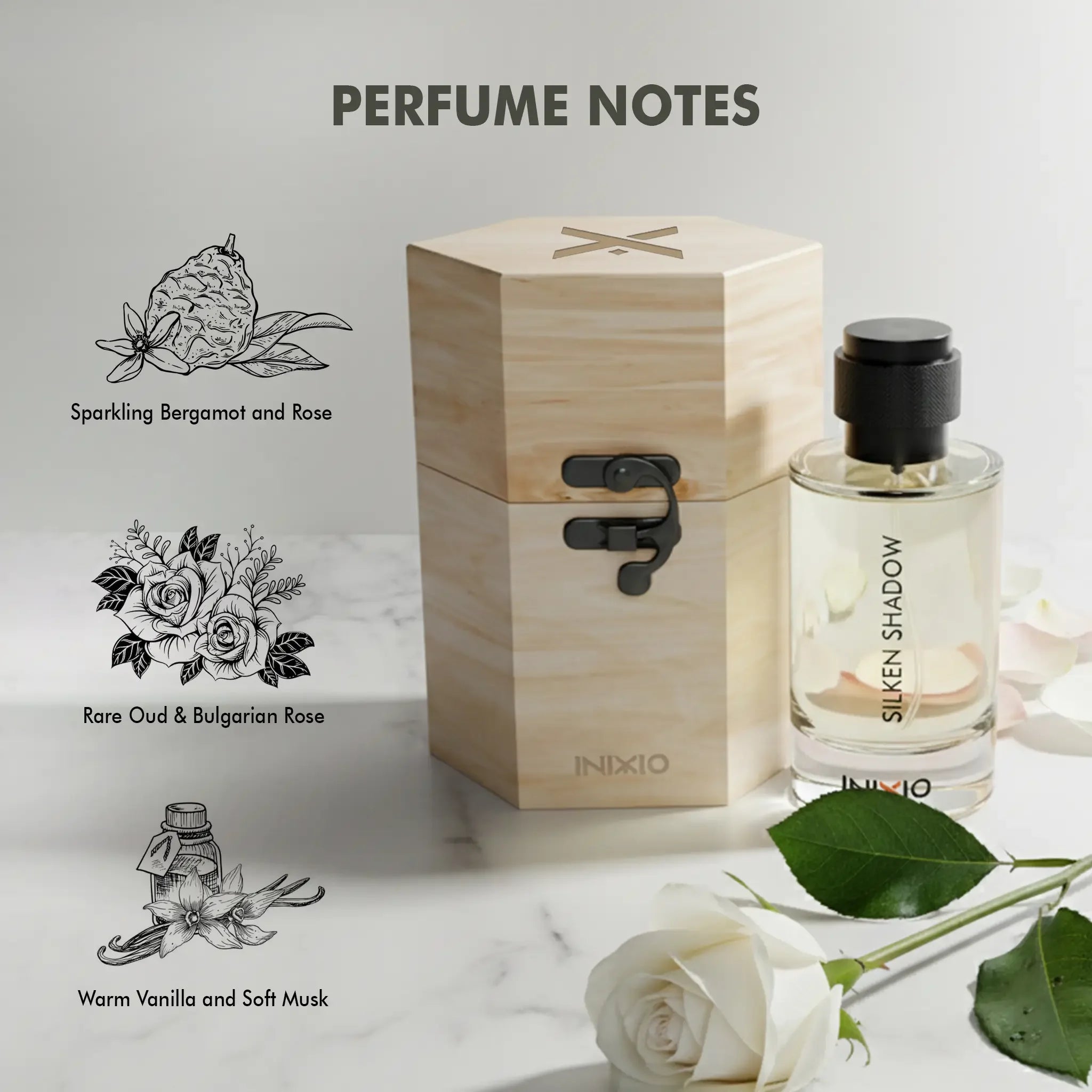 Silken Shadow perfume bottle with wooden box, white rose, and perfume notes: bergamot, Bulgarian rose, oud, vanilla, and musk.